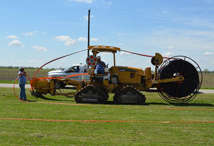 machine plowing / trenching in cable